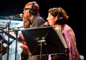Coco's Barrio actors on stage for a live radio theater performance